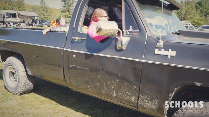Black truck, girl in pink